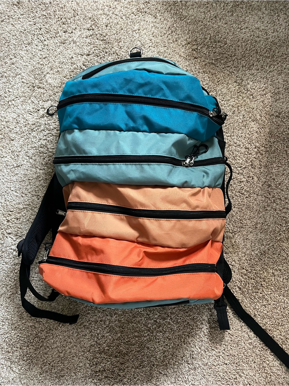 TOBIQ 30L BACKPACK DUFFEL 
Multi-Color - Blue, Teal, Peach, Orange